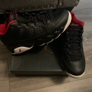 Black, white, and red Jordan’s 9s retro low